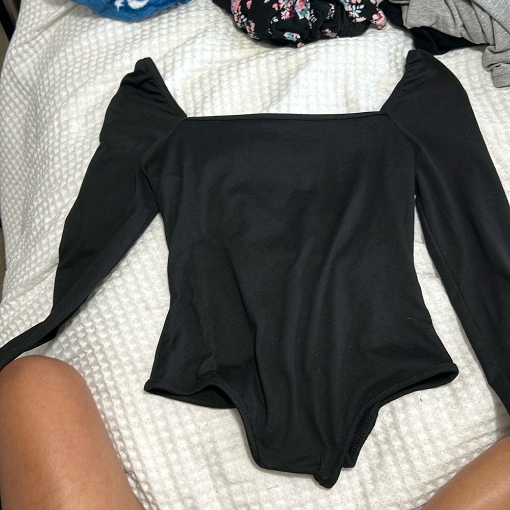 A black long sleeve body suit